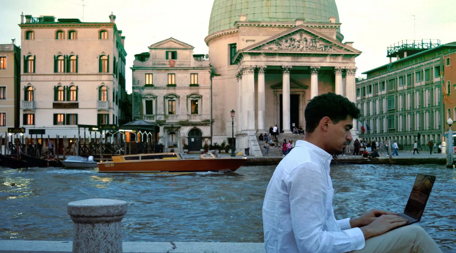 Young person working on a laptop from Venice, Italy